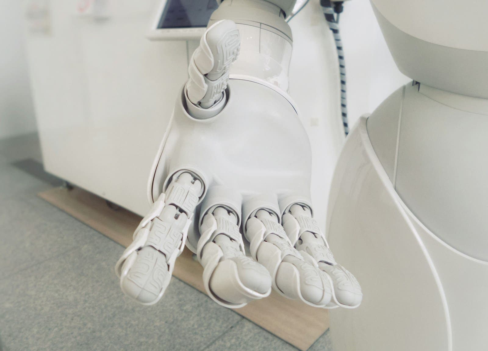 Robotic hand representing business process automation and AI