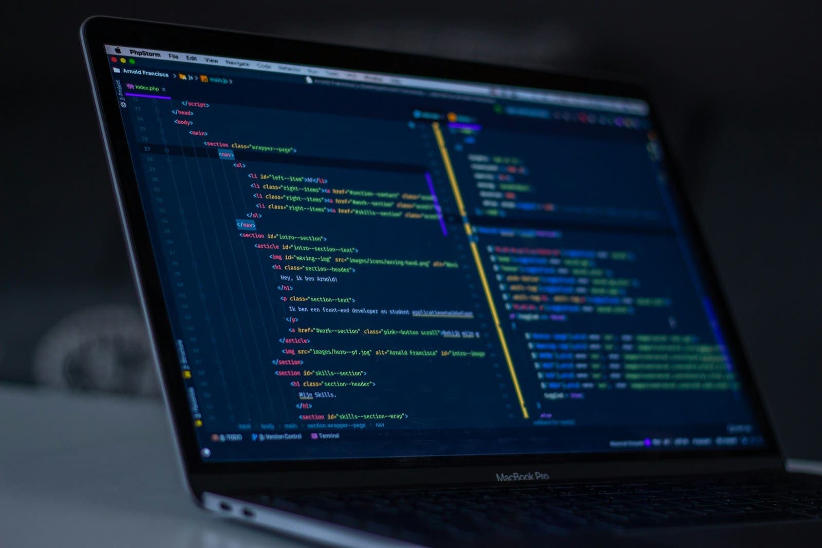 Laptop screen with website source code during web development