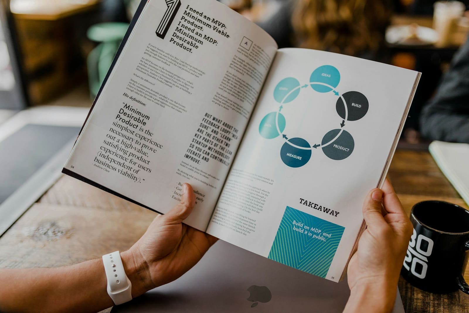 Business owner reviewing a marketing strategy report with a customer journey diagram