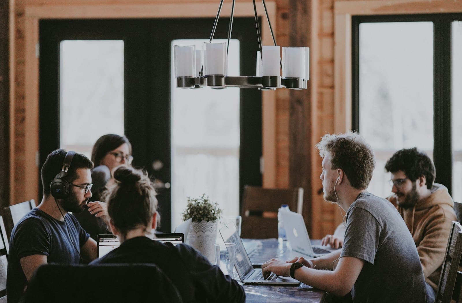 Colleagues working together around a table in a bright office